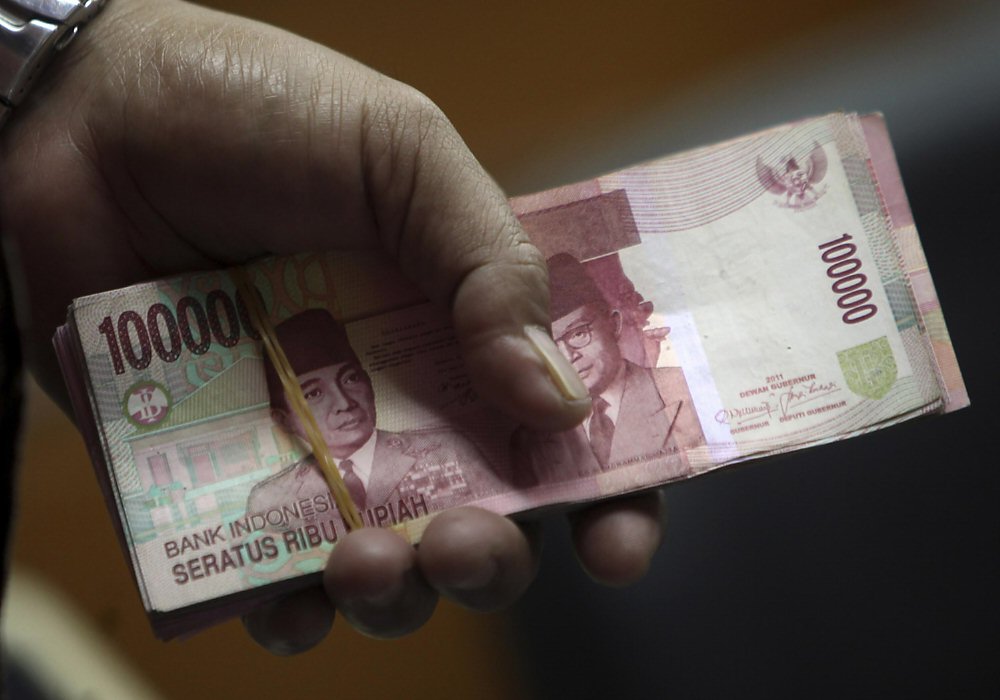 印尼央行為支撐疲軟的貨幣,24日意外宣布升息1碼。圖/美聯社 image