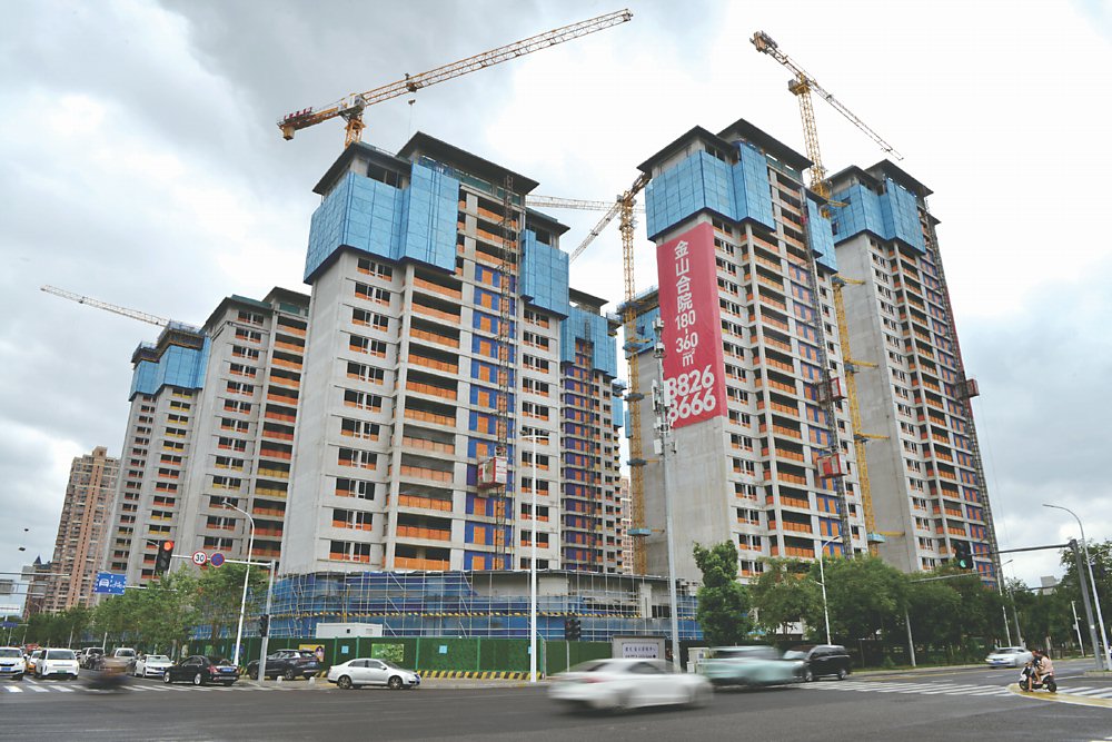 近日大陸各地房市利多政策頻出,貸款利率下調、降低首付等措施刺激多城房市持續升溫。圖/中新社 image