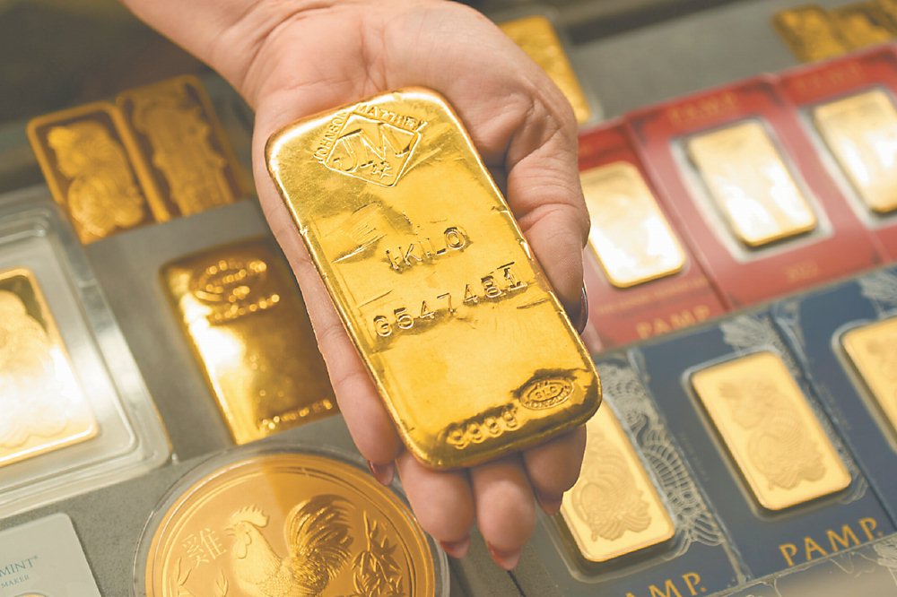 金價大反轉,重挫超過6%,創12年來最大單日跌幅。但華爾街認為金市多頭格局不變,仍是今年最強資產。圖/美聯社 image