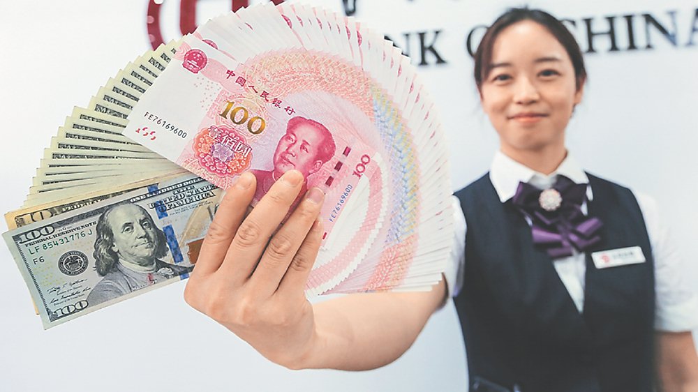 人民幣走強,在岸價盤中升破7.1元大關,創近一年新高,短線將維持偏強格局。圖/中新社 image